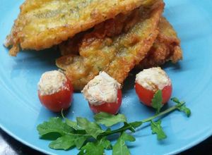 Una foto de Lomitos de pejerrey con tomatitos cherry rellenos