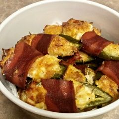A picture of Stuffed Jalapeños wrapped in Turkey bacon.
