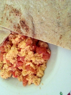 A picture of Scrambled Eggs with Tomatoes.