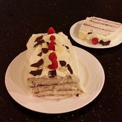 A picture of White Chocolate Layered Torte with Rasberry and White Chocolate Cream.