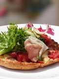 Proscuitto Pizza On Pita Bread Top Salad