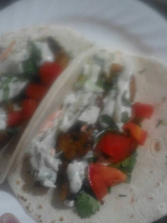 A picture of Creamy lime cilantro shrimp tacos.