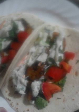 A picture of Creamy lime cilantro shrimp tacos.