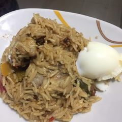 A picture of Concoction Jollof with Chicken.