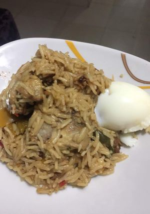 A picture of Concoction Jollof with Chicken.