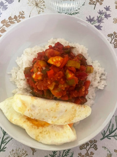 A picture of Pisto with Rice and Fried Eggs.