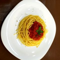 A picture of Spaghetti with Fresh Tomato sauce.