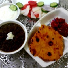 A picture of Sarso ka saag aur makki ke roti.