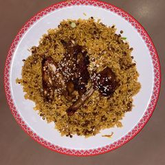 A picture of Lentil rice with grilled chicken.