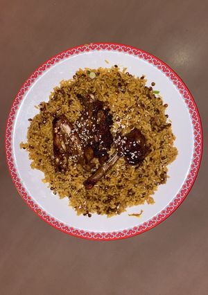 A picture of Lentil rice with grilled chicken.