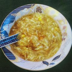 A picture of Chicken corn noodles soup.