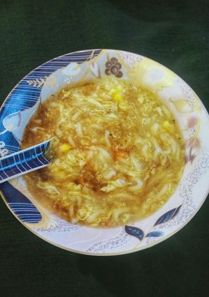 A picture of Chicken corn noodles soup.
