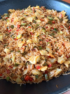 A picture of Schezwan Egg Fried Rice.
