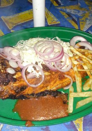 A picture of Grilled fish with irish potatoes and cucumber.