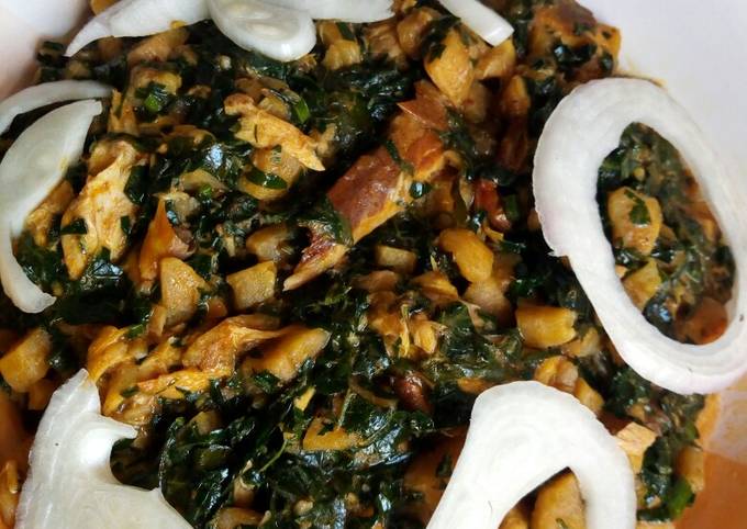 Unripe plantain porridge with smoked fish and vegetables