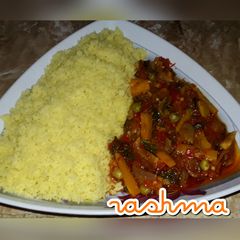 A picture of Couscous with vegetable sauce.