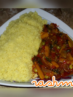 A picture of Couscous with vegetable sauce.