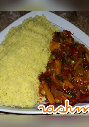A picture of Couscous with vegetable sauce.