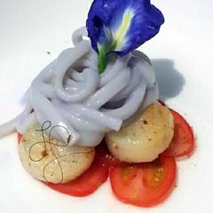A picture of Blue Alfredo Pasta With Scallop And Tomato For 4th Of July.