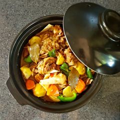 A picture of Goat stew in tomato sauce.