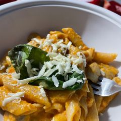 A picture of Mushroom in pink sauce pasta.