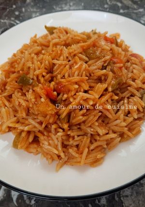 Une photo de Riz tomate poivrons 🍴