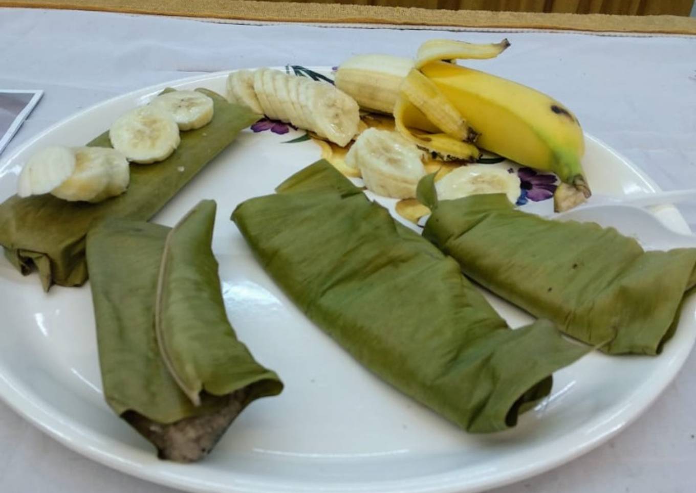 Steamed banana cake wrapped in banana leaves