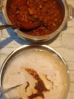 A picture of Ugali with beef and sukuma.