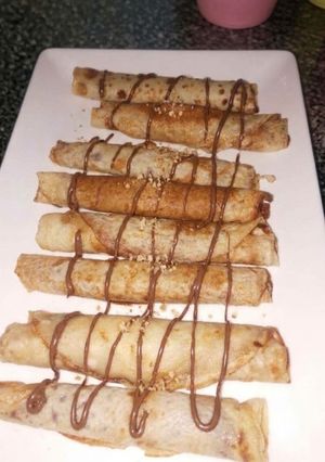A picture of Chocolate-Filled Crepes 🍫🤎🥞.