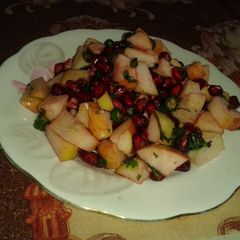 A picture of Peanuts and fruit salad.