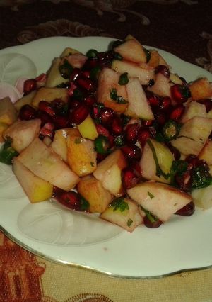 A picture of Peanuts and fruit salad.