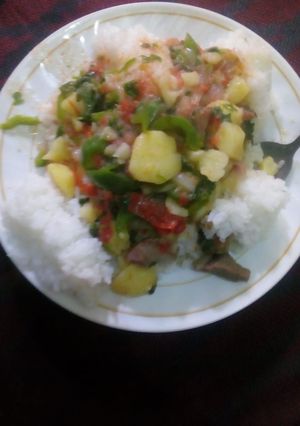 A picture of Boiled rice served with beefstew # authormarathon#.