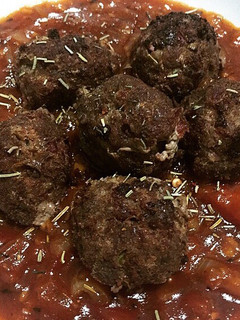A picture of Homemade Meatballs with Bolognese Sauce.