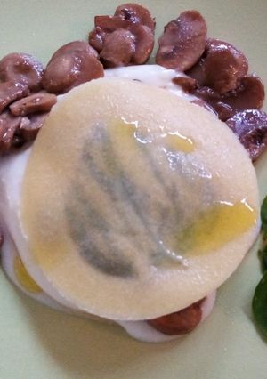 A picture of Open Raviolo with Béchamel and Mushrooms.