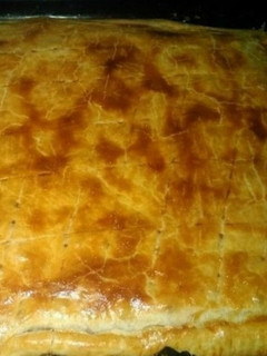 Una foto de Empanada de carne picada con pimientos