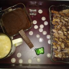 A picture of Churros with chocolate sauce.