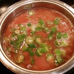A picture of Pinto beans oxtails.smoked turkey necks.