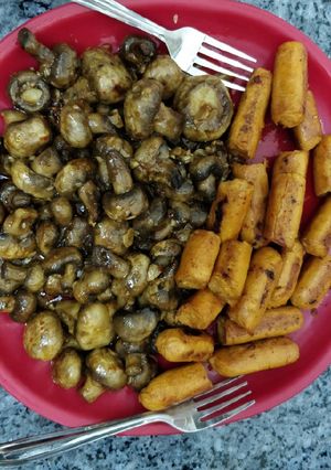 A picture of Sauteed Mushrooms with Sausages.