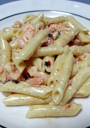 A picture of Penne with shrimps & salmon.