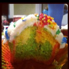 A picture of rainbow cupcakes.