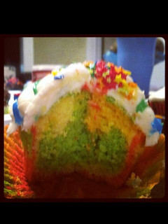 A picture of rainbow cupcakes.