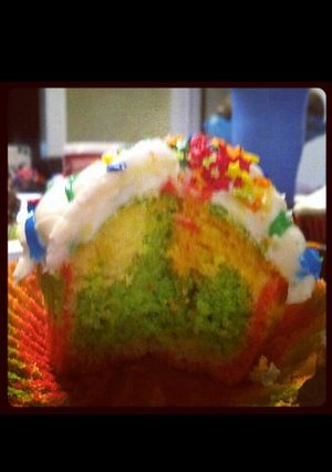 A picture of rainbow cupcakes.
