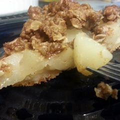 A picture of crumble topped pear pie.