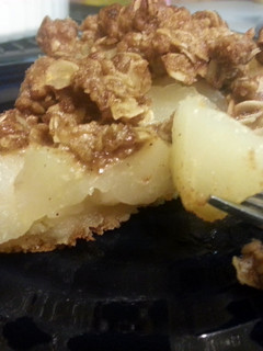 A picture of crumble topped pear pie.