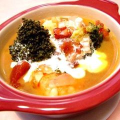 A picture of Creamy Tomato Soup with Shrimp and Broccoli.