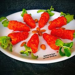 A picture of Gajar Halwa In Gajar Shape - Fancy Style Desi Dessert On the 1st Day of New Year 2026 Party.