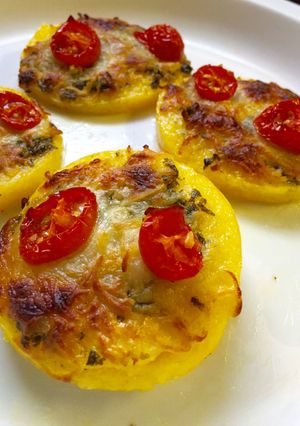 A picture of Mini Polenta Pizzas With Tomatoes And Pesto.