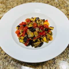 A picture of Roasted eggplant and red pepper salad.
