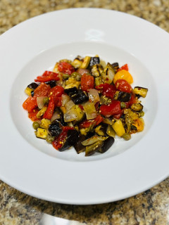 A picture of Roasted eggplant and red pepper salad.