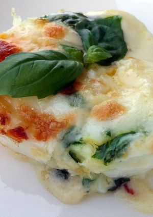 A picture of Baked Cheesy Egg With Basil Sauce.